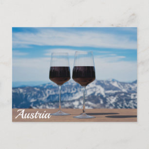 Two glasses of red wine against mountains postcard