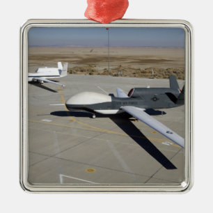 Two Global Hawks parked on a ramp Metal Tree Decoration