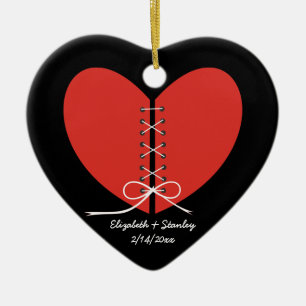 Two halves of a heart tied with a ribbon ornament