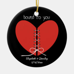 Two halves of a heart tied with a ribbon ornament