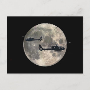 two helicopters silhouetted by a full moon postcard