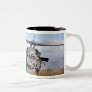 Two HH-60 Pavehawk helicopters preparing to lan Two-Tone Coffee Mug