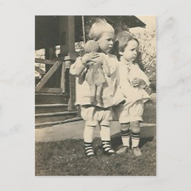 Two kids with a doll outside postcard (Front)
