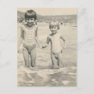 Two little girls holding hands sisters postcard