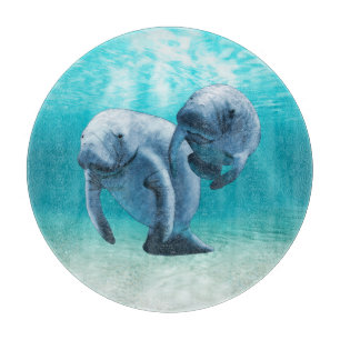 Two Manatees Swimming Cutting Board