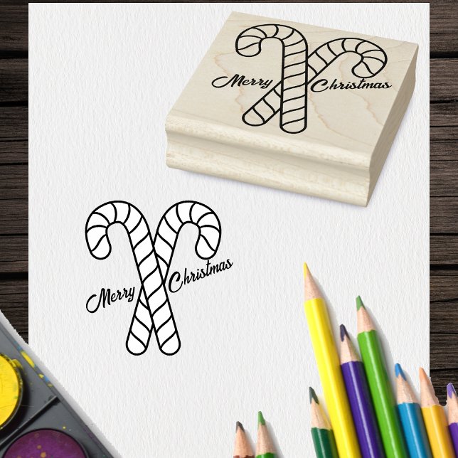 Two Merry Christmas Crossed Candy Cane outline Rubber Stamp (Two crossed striped candy canes with Merry Christmas on craft rubber holiday stamp.)