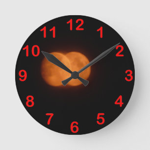 Two moons round clock