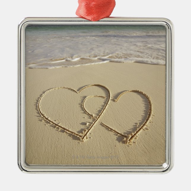 Two overlying hearts drawn on the beach metal tree decoration (Front)