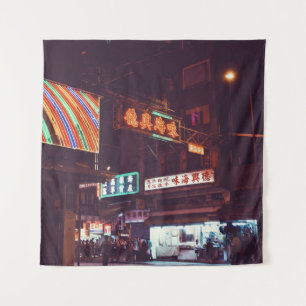 TWO PERSON WALKING ALONG THE ROAD UNDER SIGNAGE BE TAPESTRY