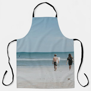 Two person walking on coast apron