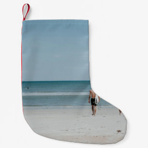 Two person walking on coast small christmas stocking