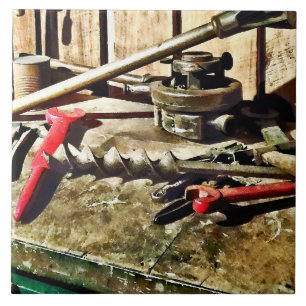 Two Red Wrenches on Plumber's Workbench Tile