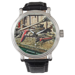 Two Red Wrenches on Plumber's Workbench Watch