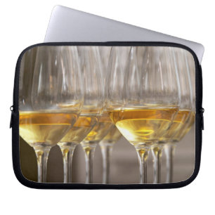 two rows of wine tasting glasses with lucious laptop sleeve