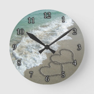 Two Sand Hearts on the Beach Round Clock