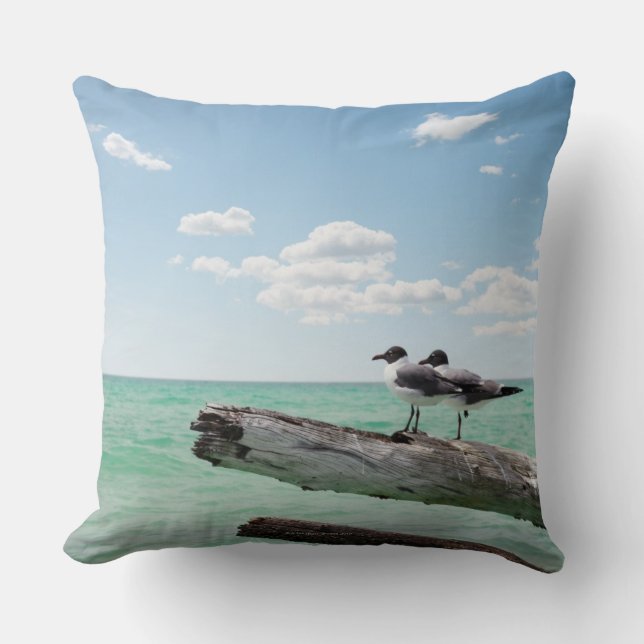 Two seagulls sitting on a dead tree sticking out cushion (Front)