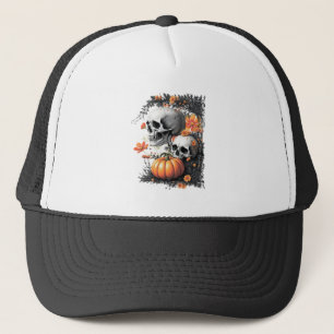 Two skulls and a pumpkin among flowers. trucker hat
