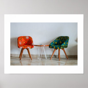 Two Stylish Chairs with a Table Poster