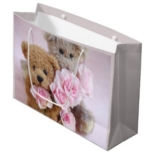 Two teddy bears holding roses large gift bag
