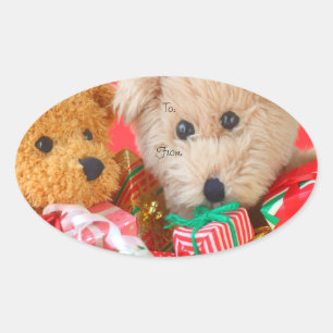 Two teddy bears with Christmas present Oval Sticker