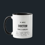 Two Tone A Wise Doctor Once Wrote Funny Novelty Mug<br><div class="desc">Bring some humour to your coffee break with this clever mug featuring the text "A Wise Doctor Once Wrote" alongside a graphic of illegible handwriting. Perfect for doctors, nurses, healthcare professionals, medical students, or anyone who’s ever tried to decipher a doctor’s notes! This playful design is sure to get a...</div>