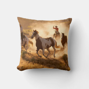 Two western cowboys riding horses, roping wild hor cushion