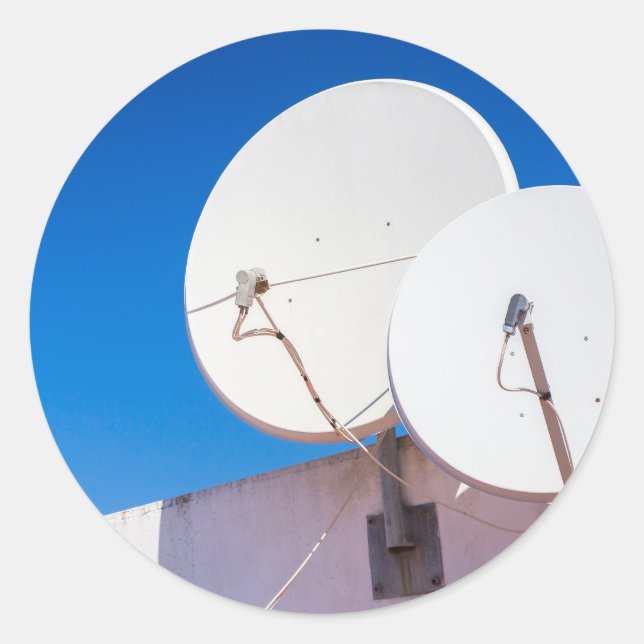 Two white satellite dishes on house wall classic round sticker (Front)
