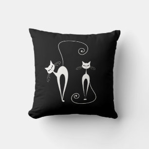 Two White Stylised Cats on Black Cushion