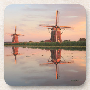 Two windmills with reflection at sunset coaster