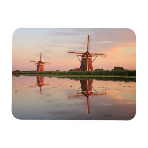 Two windmills with reflection at sunset magnet