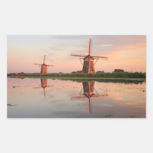 Two windmills with reflection at sunset rectangular sticker