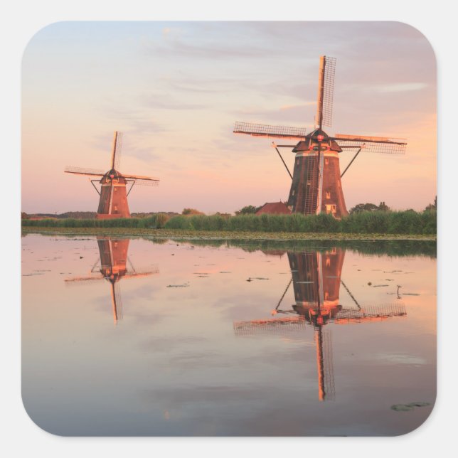 Two windmills with reflection at sunset square sticker (Front)