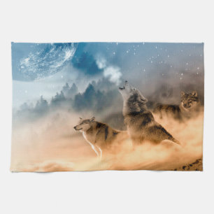 Two wolves howl at the full moon in forest tea towel