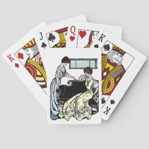 Two Women in Long Dresses Playing Cards