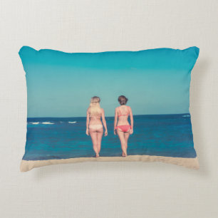 TWO WOMEN WEARING BIKINI STANDING ON SHORE DECORATIVE CUSHION