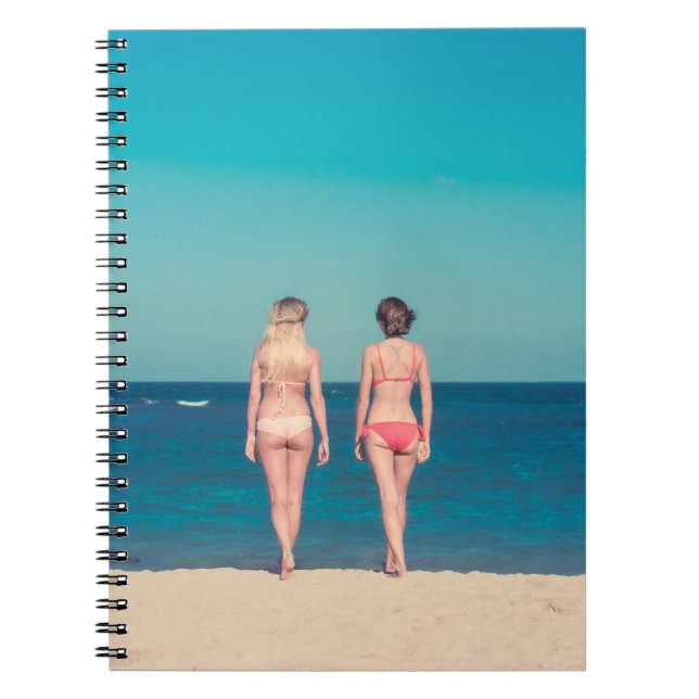 TWO WOMEN WEARING BIKINI STANDING ON SHORE NOTEBOOK (Front)