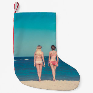TWO WOMEN WEARING BIKINI STANDING ON SHORE SMALL CHRISTMAS STOCKING
