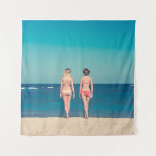 TWO WOMEN WEARING BIKINI STANDING ON SHORE TAPESTRY
