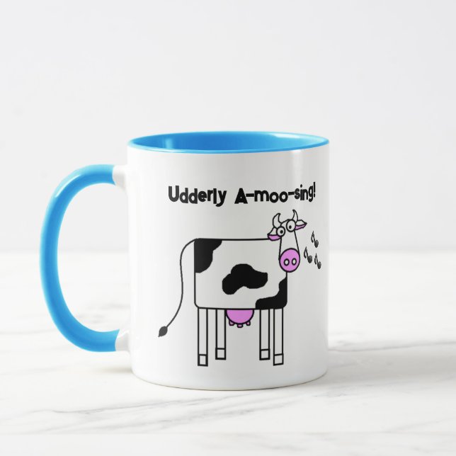 Udderly A-moo-sing Singing Cow Pun Cartoon Design Mug (Left)