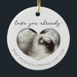 Ultrasound Pregnancy Announcement Keepsake Heart Ceramic Ornament<br><div class="desc">Celebrate the greatest gift this holiday season with our "love you already" ultrasound heart baby announcement ornament! I perfect way to surprise grandparents, siblings, or even new dad! You will remember the joy of new life for years to come with this sentimental keepsake. • Looking for something a little different?...</div>