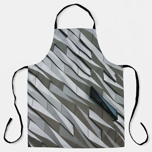 Undulating abstract shapes on a building facade at apron (Front)