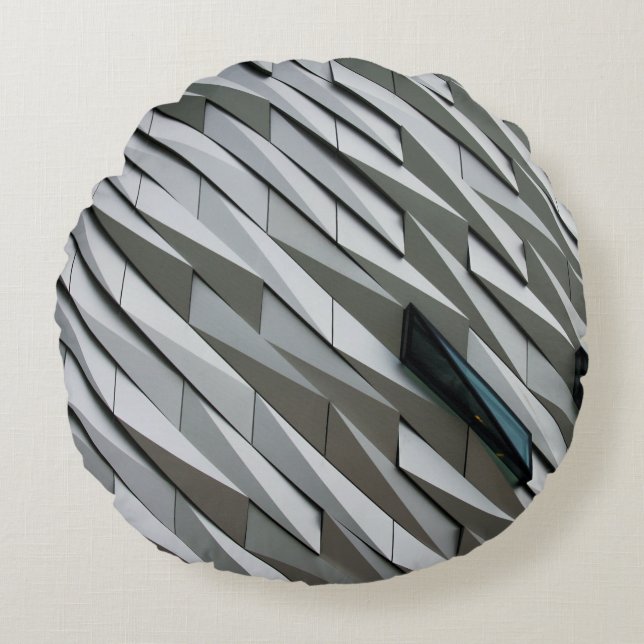 Undulating abstract shapes on a building facade at round cushion (Front)