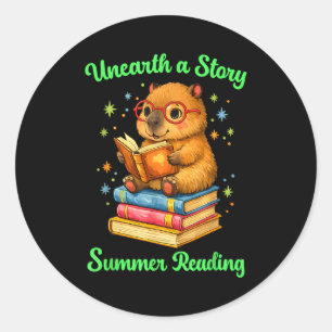 Unearth a story capybara reading books summer classic round sticker