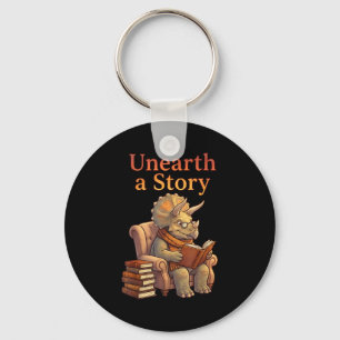 Unearth a story triceratops dinosaur reading books key ring