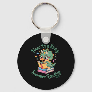 Unearth a story triceratops dinosaur reading books key ring