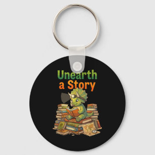 Unearth a story triceratops dinosaur reading books key ring