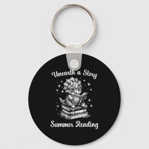 Unearth a story triceratops dinosaur reading books key ring
