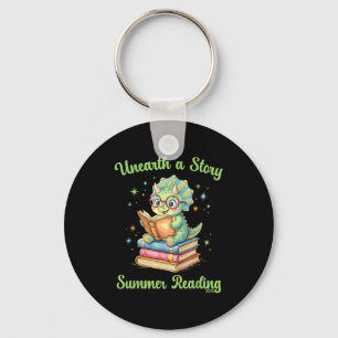 Unearth a story triceratops dinosaur reading books key ring