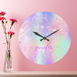 Unicorn glitter pink purple monogram name large clock<br><div class="desc">A trendy rainbow coloured background with unicorn and rainbow pastel colours in pink, purple, rose gold, mint green. Decorated with faux glitter dust in pink and purple. Decorated with a rainbow coloured unicorn. Personalise and add a name, written with a modern hand lettered style script with swashes. Purple coloured letters....</div>