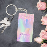 Unicorn pink glitter drips name holographic key ring<br><div class="desc">A trendy holographic background with unicorn and pastel colours in pink,  purple,  mint green. Decorated with faux glitter drips,  paint dripping look. Personalise and add your name.  Purple coloured letters.  A bit of everyday glam to brighten up your day!</div>